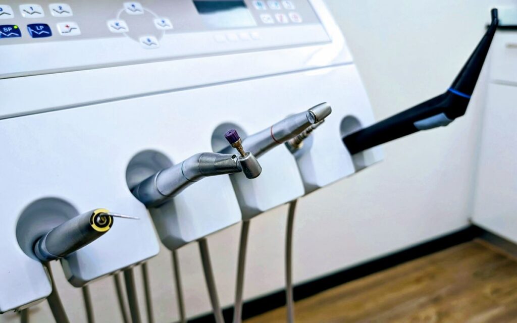 Close-up of dental instruments in a professional dental clinic setting.