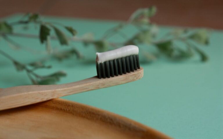 Sustainable bamboo toothbrush with herbal toothpaste. Ideal for eco-friendly living.