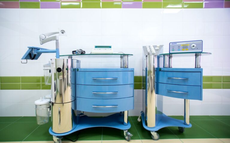 Two modern dental equipment carts in a sterile clinic environment, emphasizing hygiene.