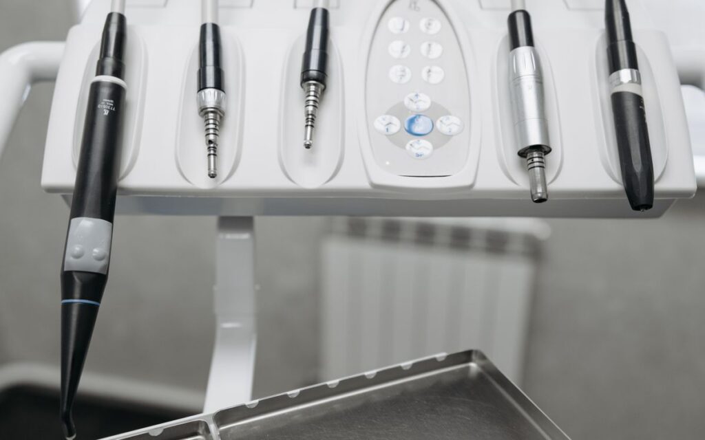 Detailed shot of modern dental tools in a dentist's office, emphasizing precision and hygiene.