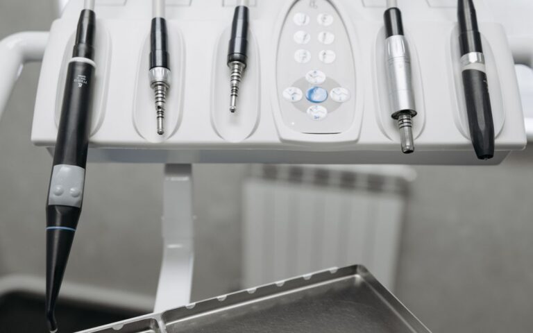 Detailed shot of modern dental tools in a dentist's office, emphasizing precision and hygiene.