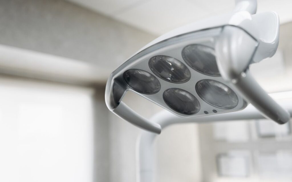 Close-up view of a modern dental operatory light inside a clinic.